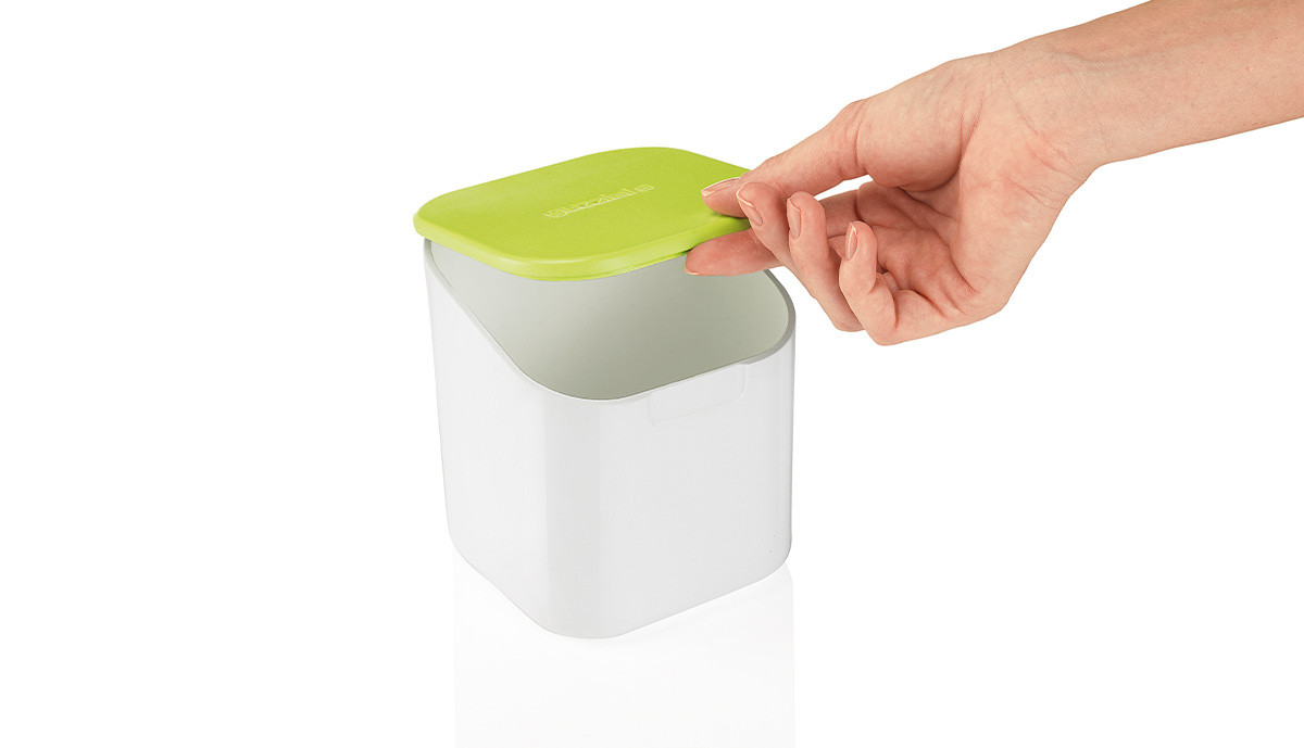 Opening the Guzzini storage container by its lid